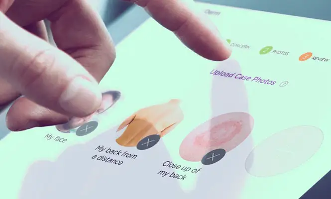 A person using a tablet to enter medical information